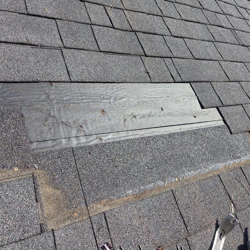 Zipper boot and asphalt shingles on roof section