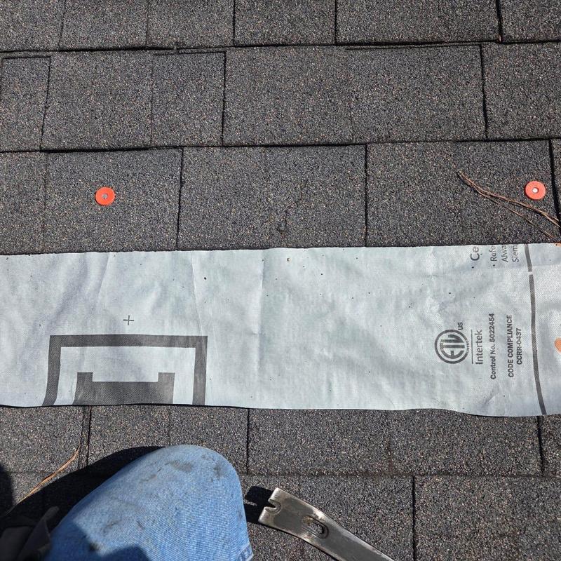 Roof shingles with new synthetic underlayment installed