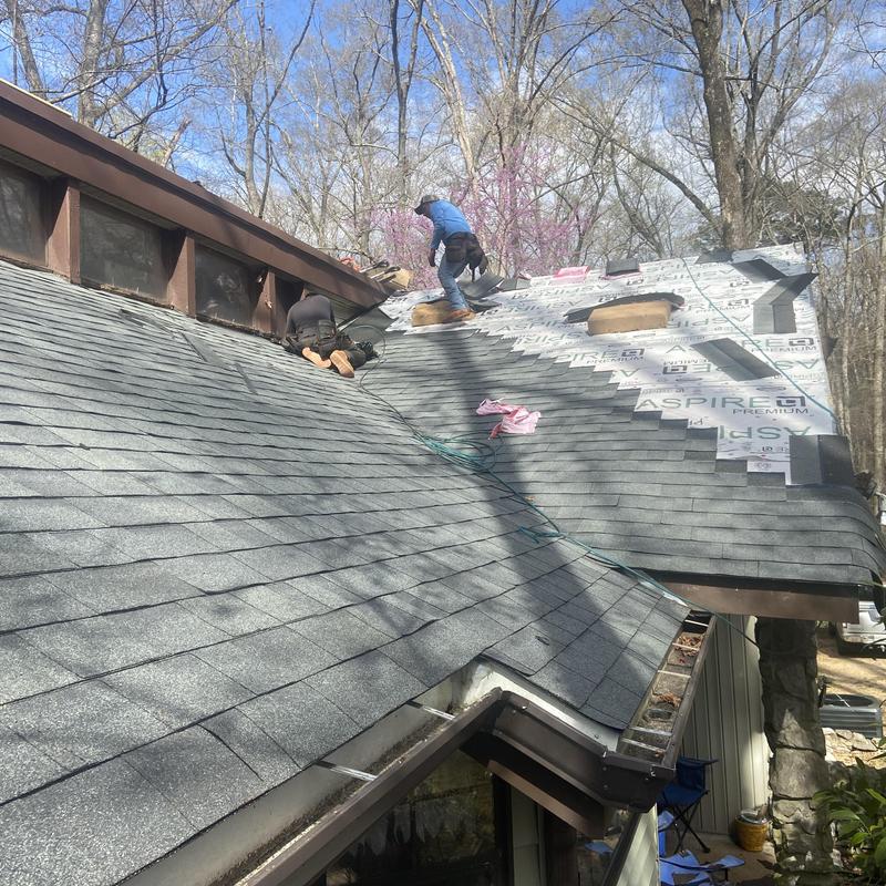 Asphalt shingle roof replacement near dormer window