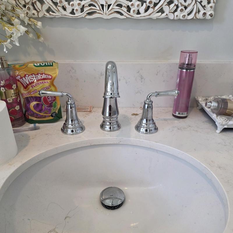 Wide spread lavatory faucet with countertop sink