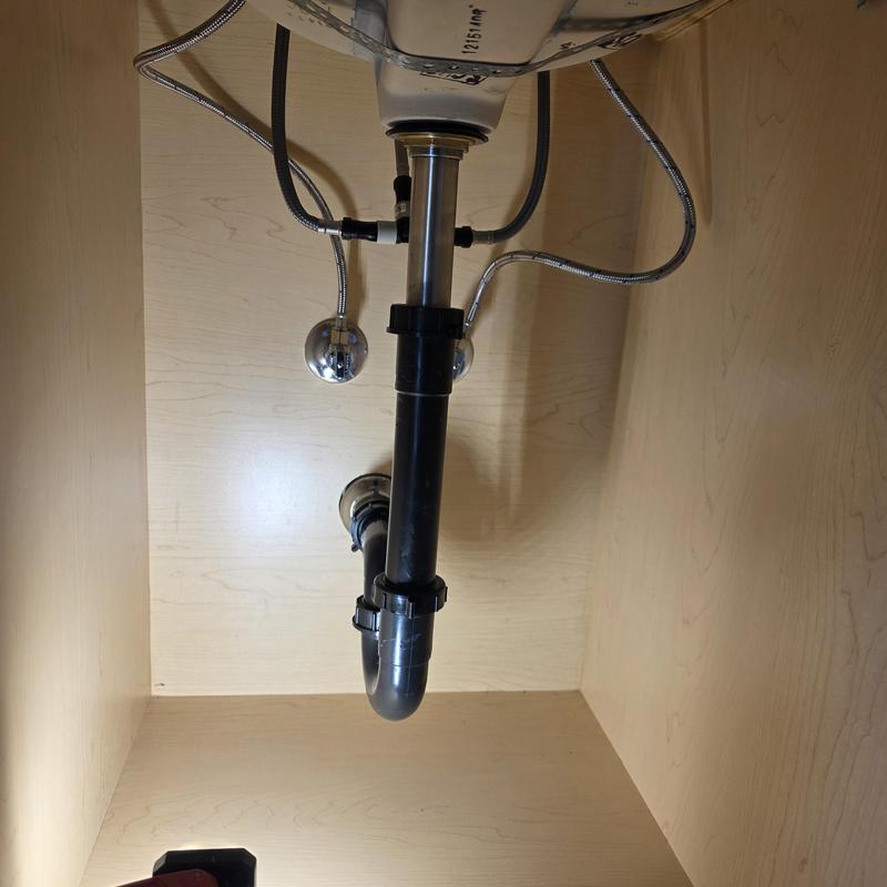 Lavatory drain pipe and water supply lines under sink