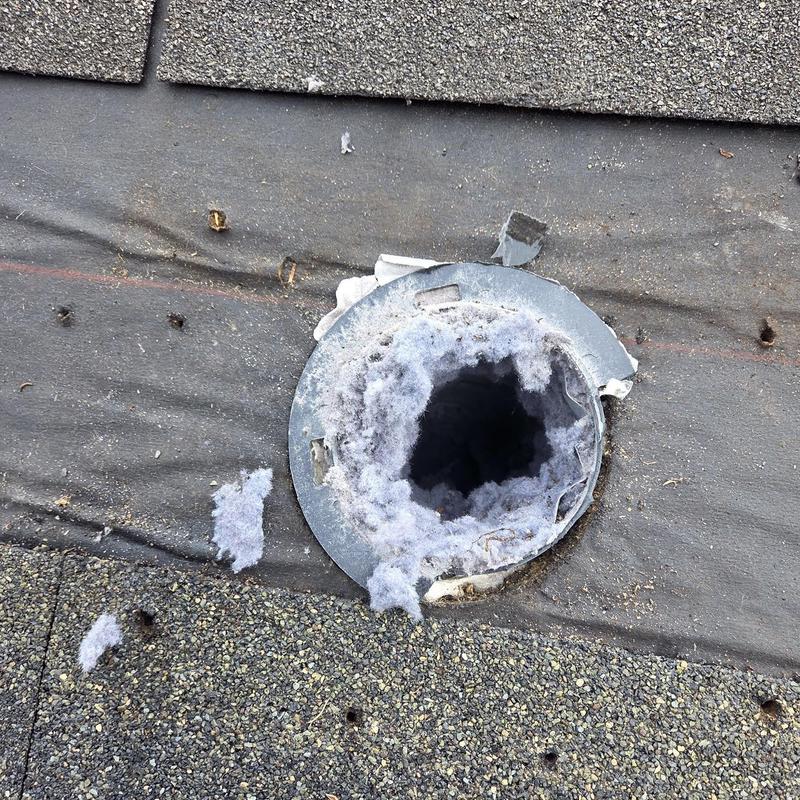 Dryer vent termination with lint buildup on roof shingles