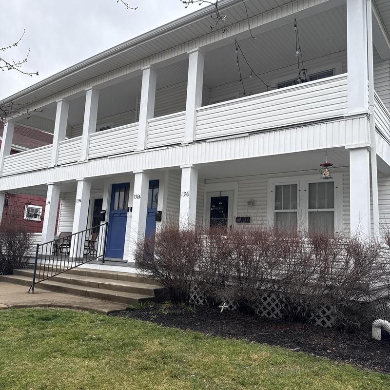 Vinyl siding inspection on two-story home exterior Vinyl siding inspection on two-story home exterior