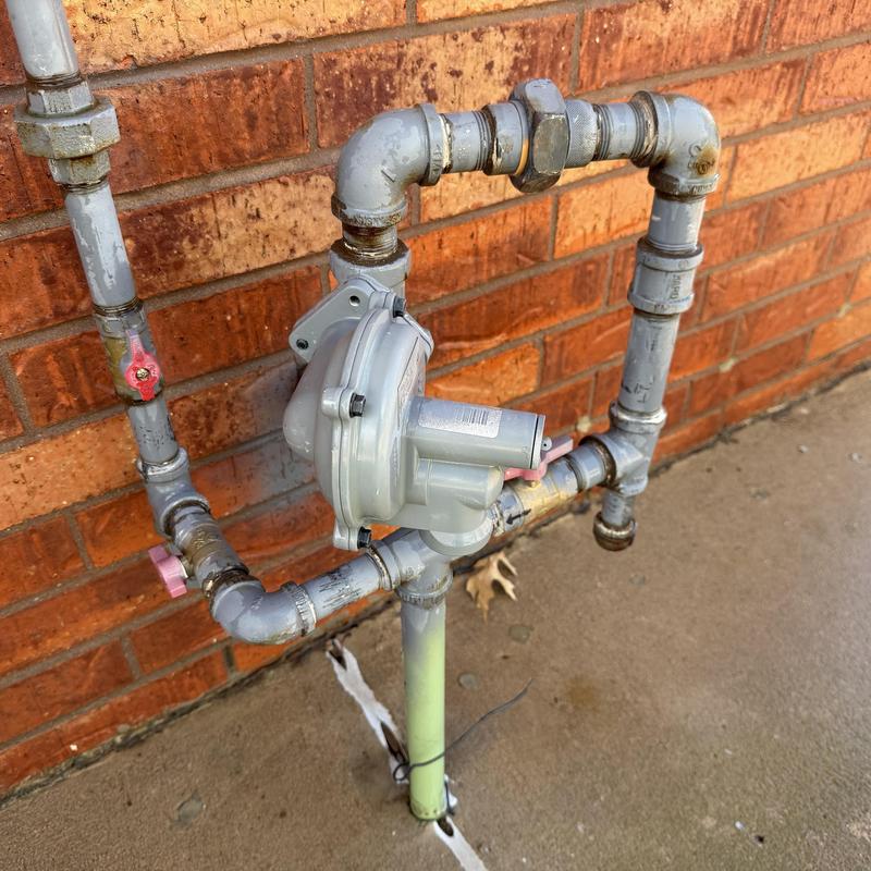 Gas regulator and piping with leak-tested connections