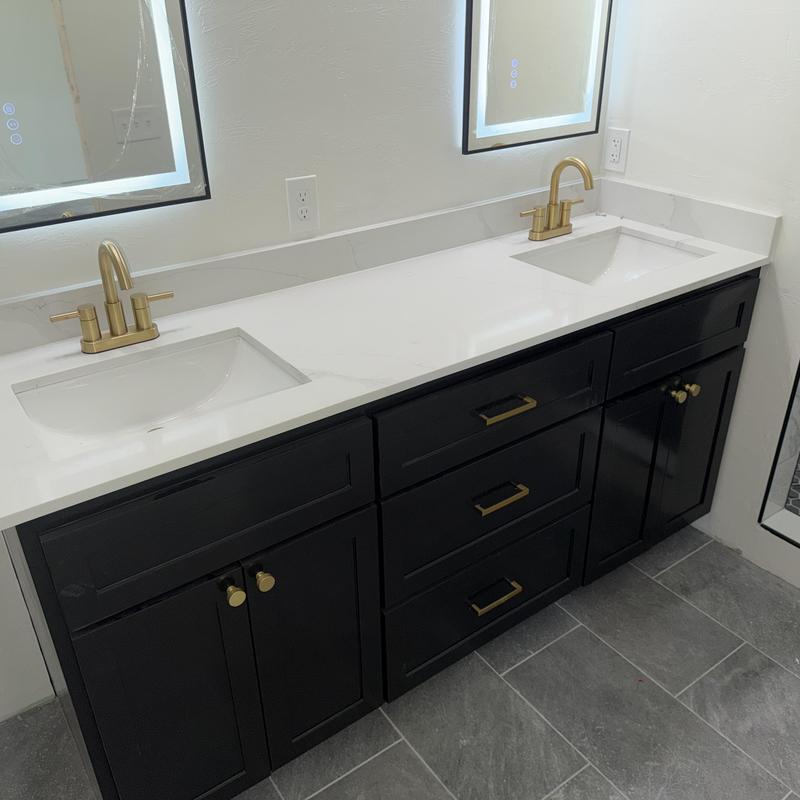 DeltaMoen brass bathroom faucets with black vanity