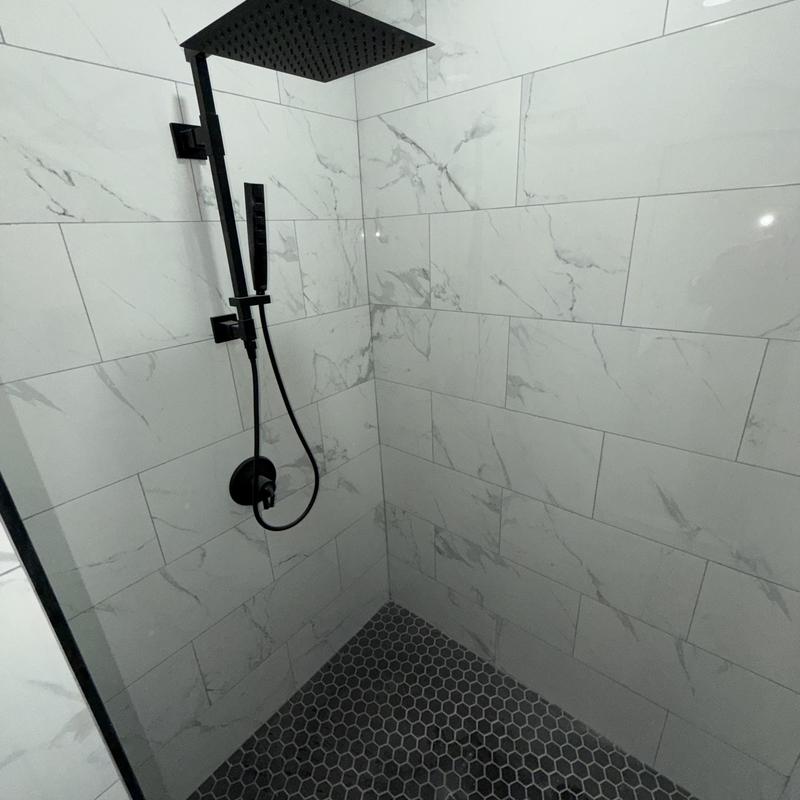 DeltaMoen black shower fixtures with rainfall showerhead