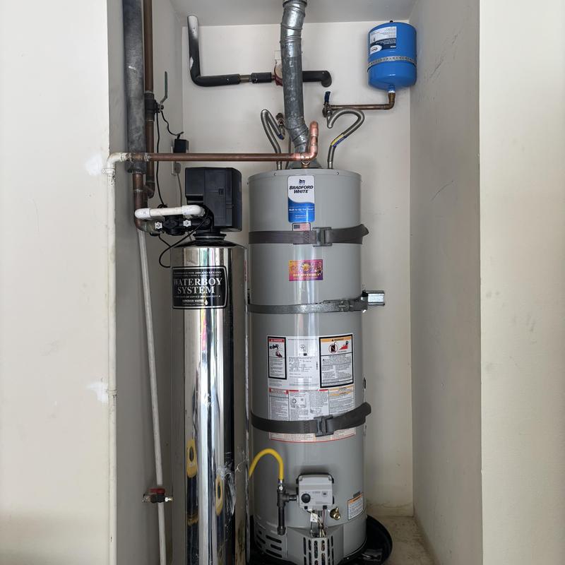 Water heater replacement with pressure tank in garage