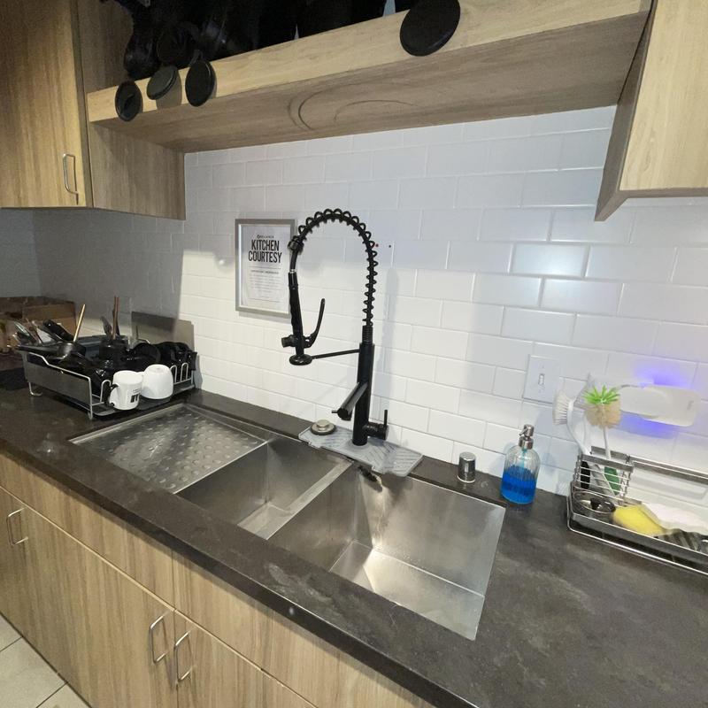 Commercial-style kitchen faucet with sprayer installed