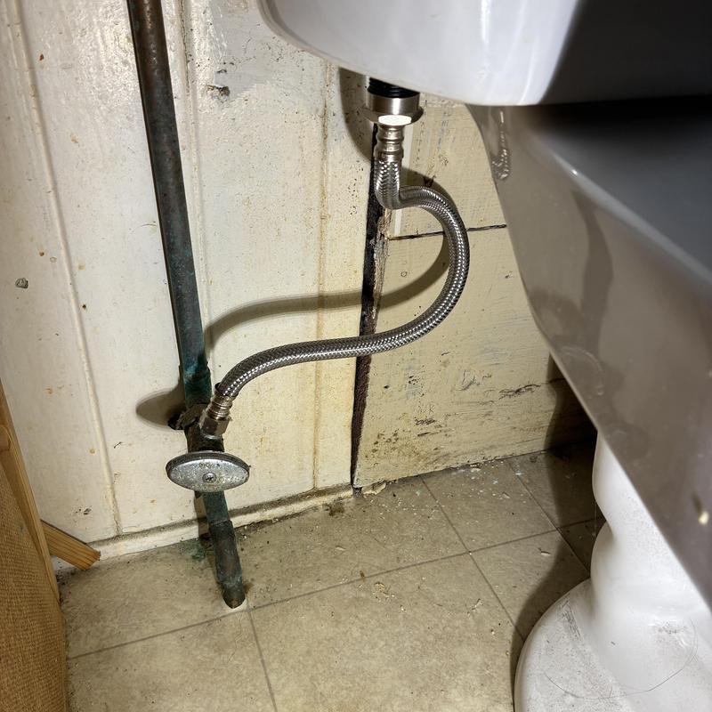 Toilet water supply line installed in multi-unit building