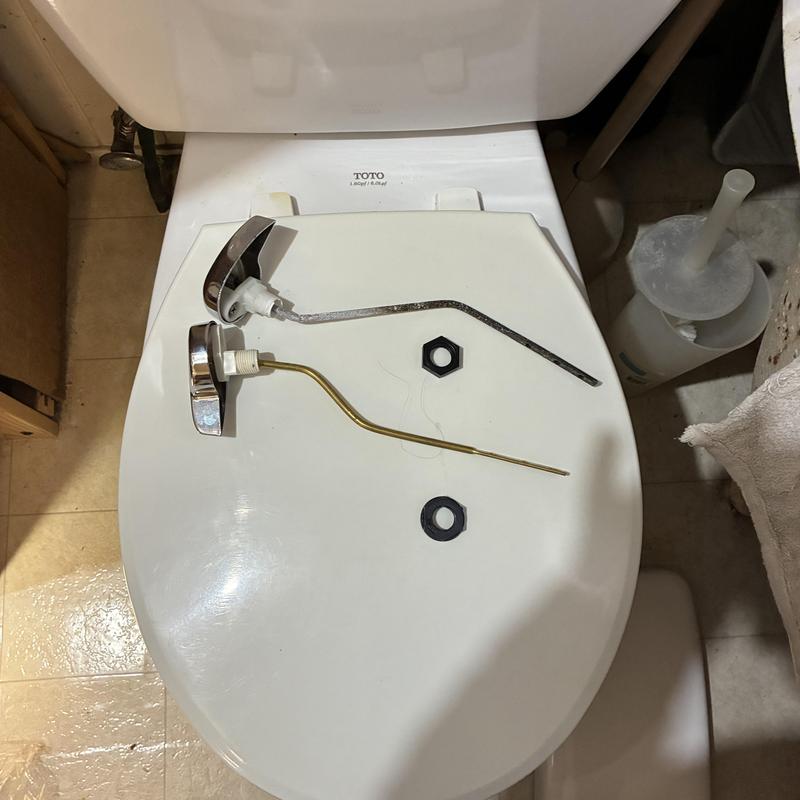 Toilet tank levers removed and replaced parts