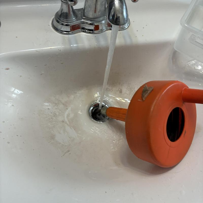 Basin drain unclogging with plunger in sink
