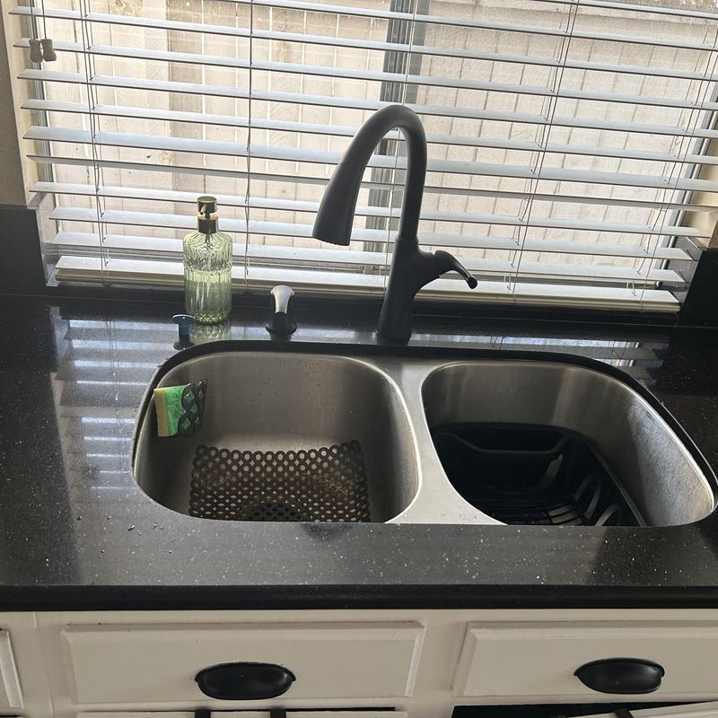 Kitchen sink faucet with black granite countertop