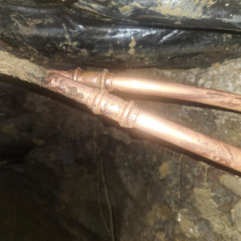 Copper water line piping under slab with fittings