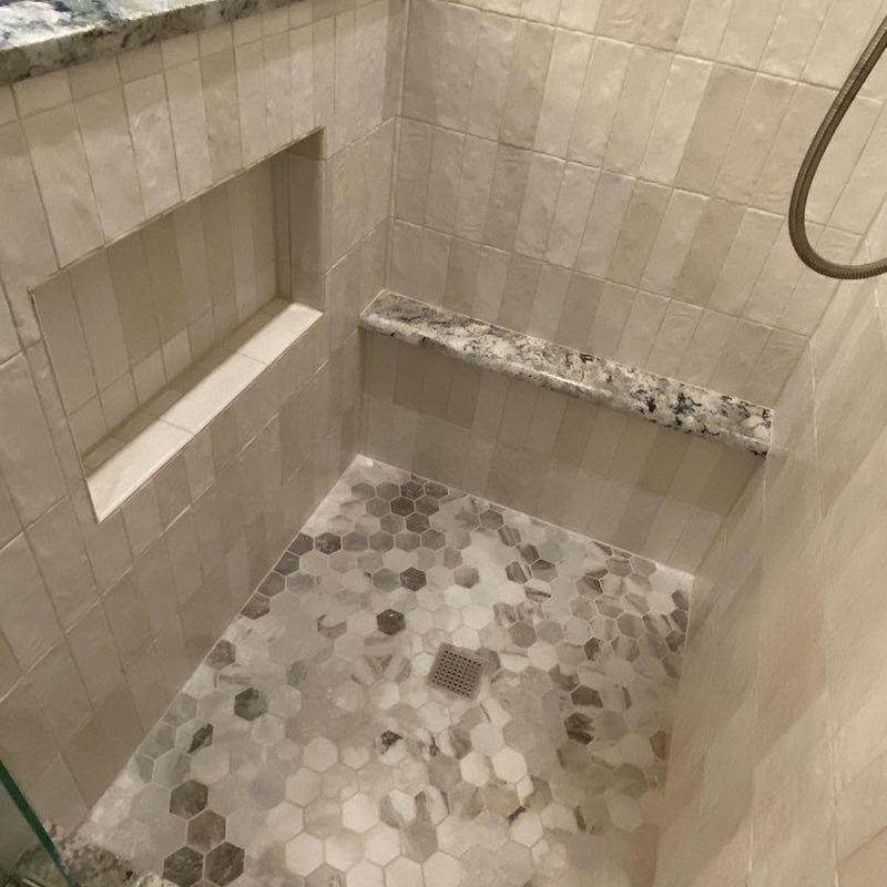Hexagon tile shower floor with granite bench and niche Hexagon tile shower floor with granite bench and niche