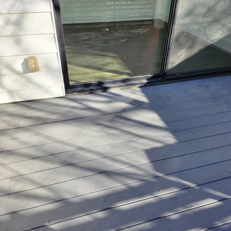 Sliding glass door track with surrounding deck area