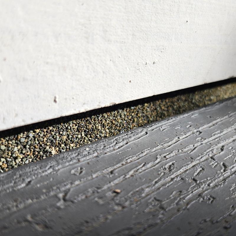 GAF rolled roofing edge with gravel and wood trim