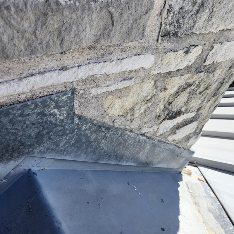 Chimney cricket metal flashing on standing seam roof Chimney cricket metal flashing on standing seam roof