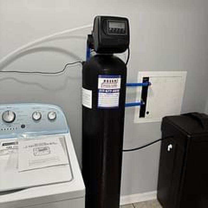 Water softener unit installation near washer and dryer