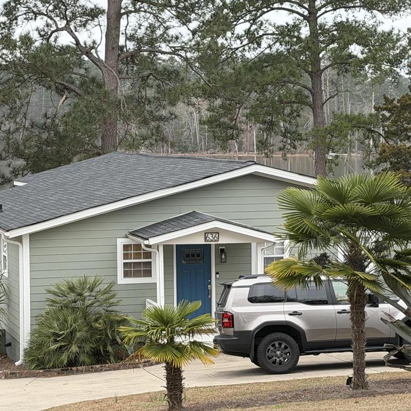 Roof shingles and new siding on house exterior