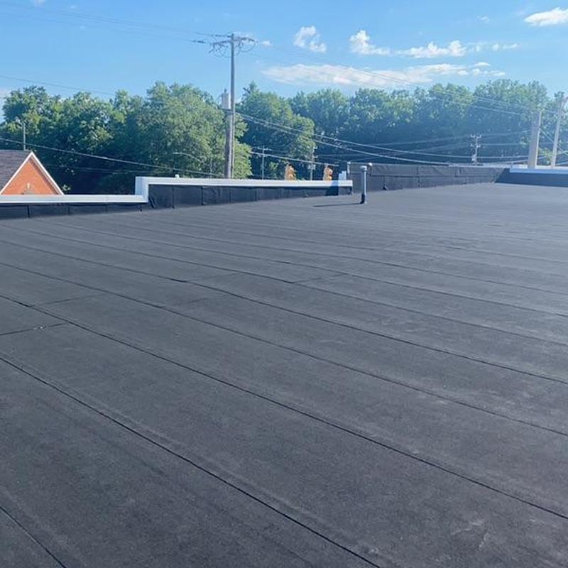 Rolled roofing with aluminum metal coping installation