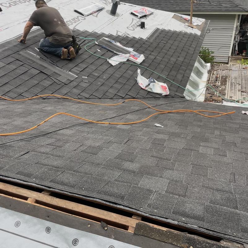 Architectural asphalt shingle roof installation in progress