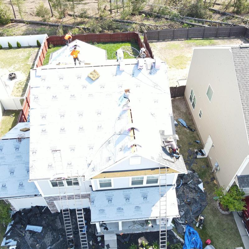 Roof underlayment installation on two-story home Roof underlayment installation on two-story home