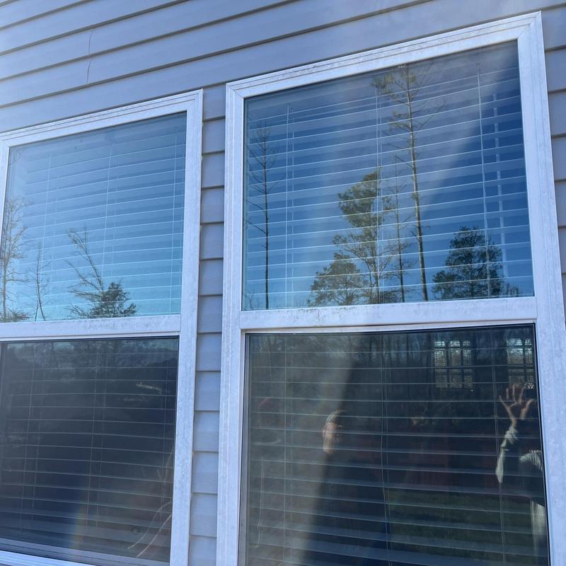 Vinyl windows with white frames and horizontal blinds Vinyl windows with white frames and horizontal blinds