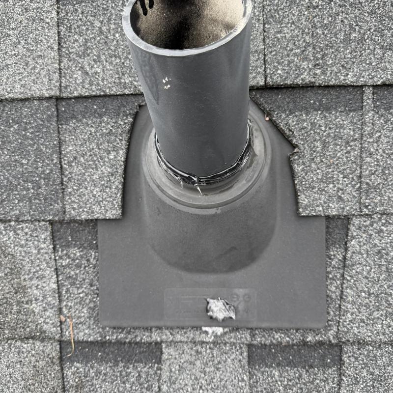 Roof vent pipe with sealed flashing and shingles