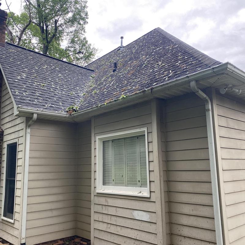 IKO Dynasty shingle roof and metal fascia with debris IKO Dynasty shingle roof and metal fascia with debris