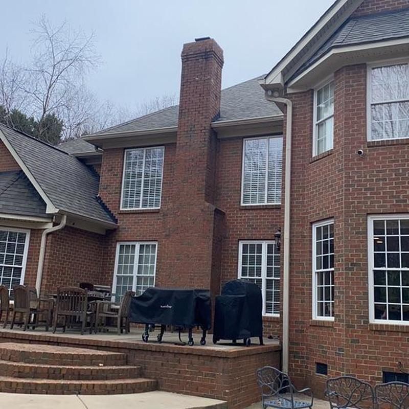 Architectural shingle roof on brick residential home Architectural shingle roof on brick residential home