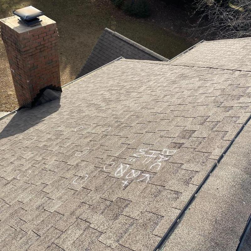 Owens Corning architectural shingle roof with storm marks Owens Corning architectural shingle roof with storm marks