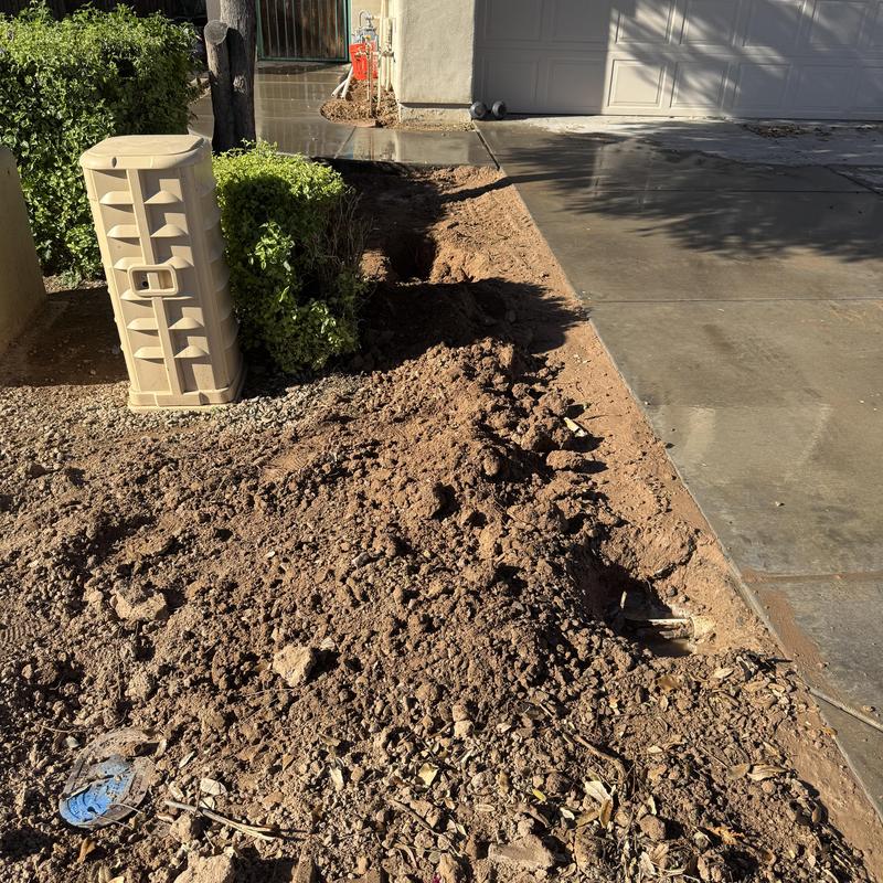 Mainline water valve excavation by driveway in Goodyear