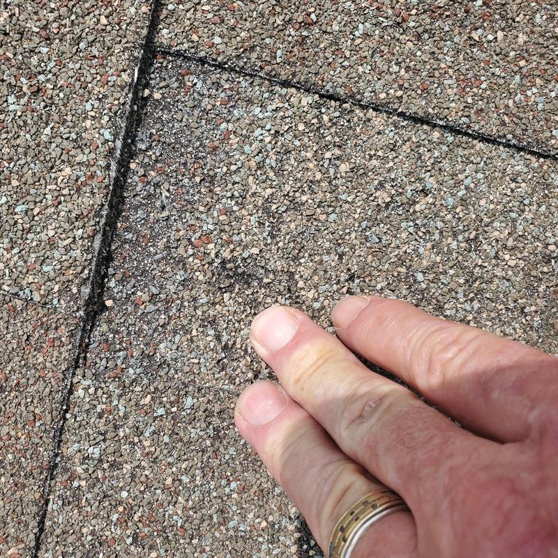 Asphalt shingle granule loss from hail storm damage
