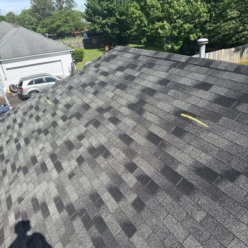Asphalt shingle roof with hail damage markings
