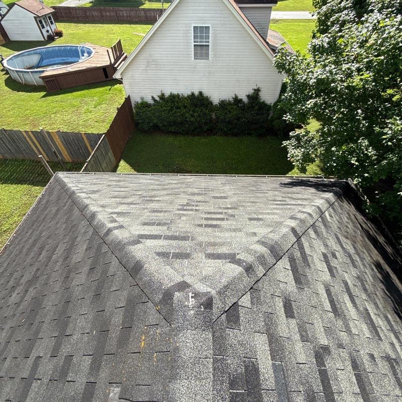 Asphalt shingle roof valley with hail damage inspection