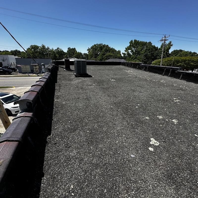 Tar and gravel commercial roof with HVAC unit Tar and gravel commercial roof with HVAC unit