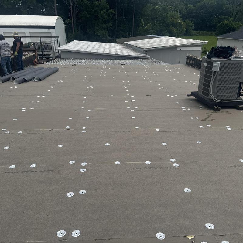 TPO roofing installation with fasteners on commercial roof TPO roofing installation with fasteners on commercial roof