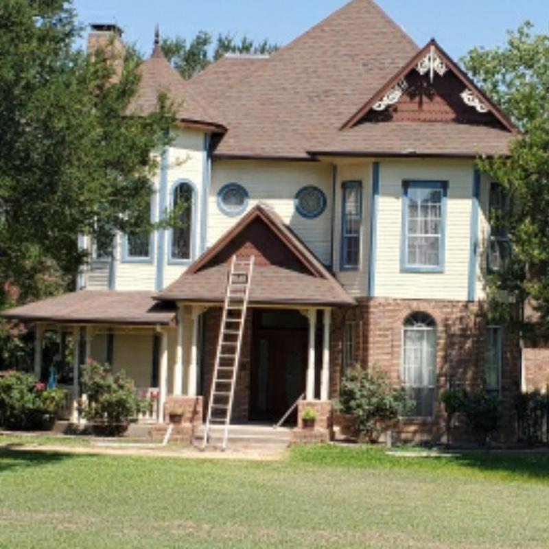 Asphalt shingle roof with ladder for hail damage inspection