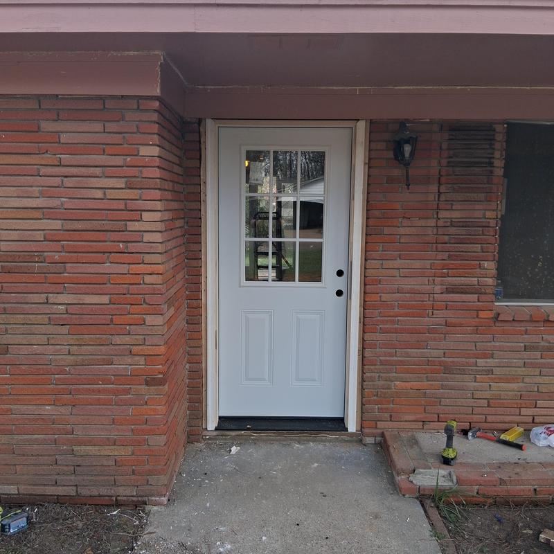Exterior door with glass panel installation and frame rebuild