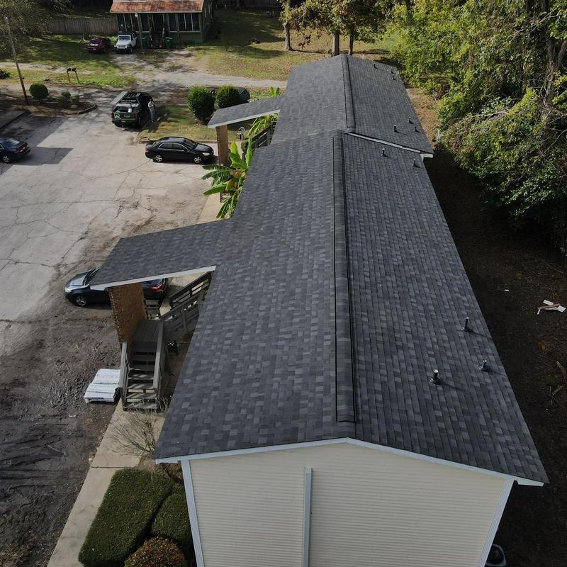 Asphalt shingle roof installation on residential building Asphalt shingle roof installation on residential building