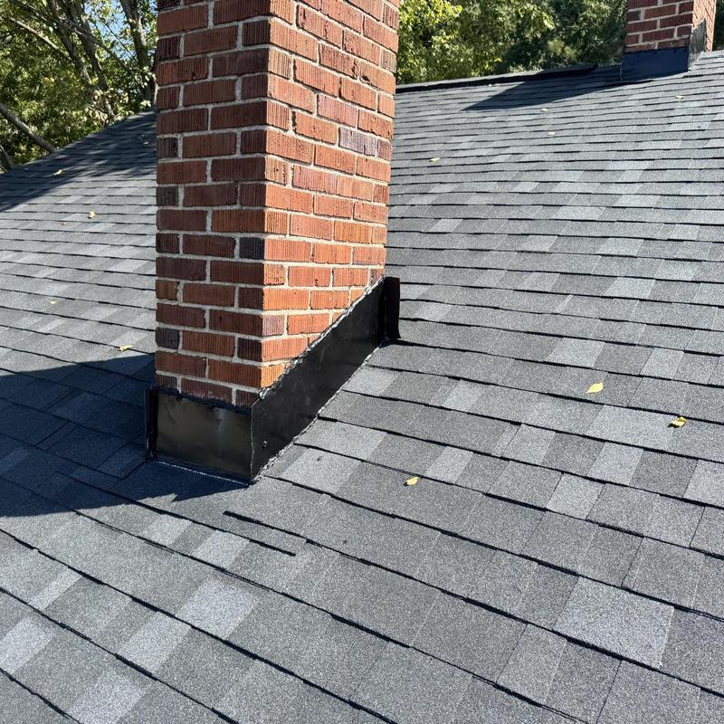 Onyx Black shingles and chimney flashing installation