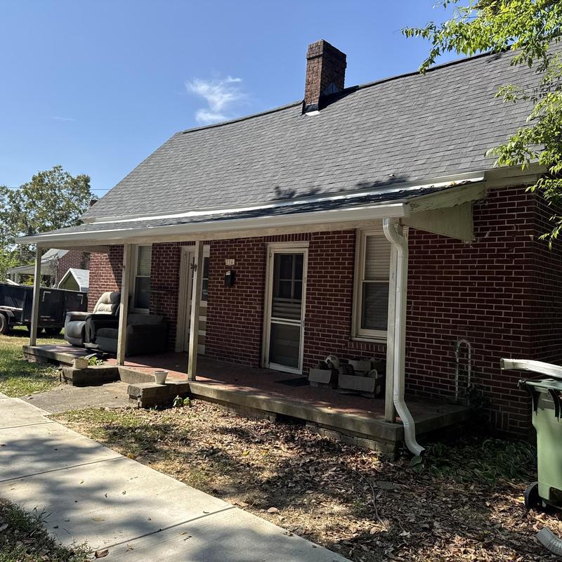 Owens Corning Oakridge Onyx Black shingle roof with white gutters