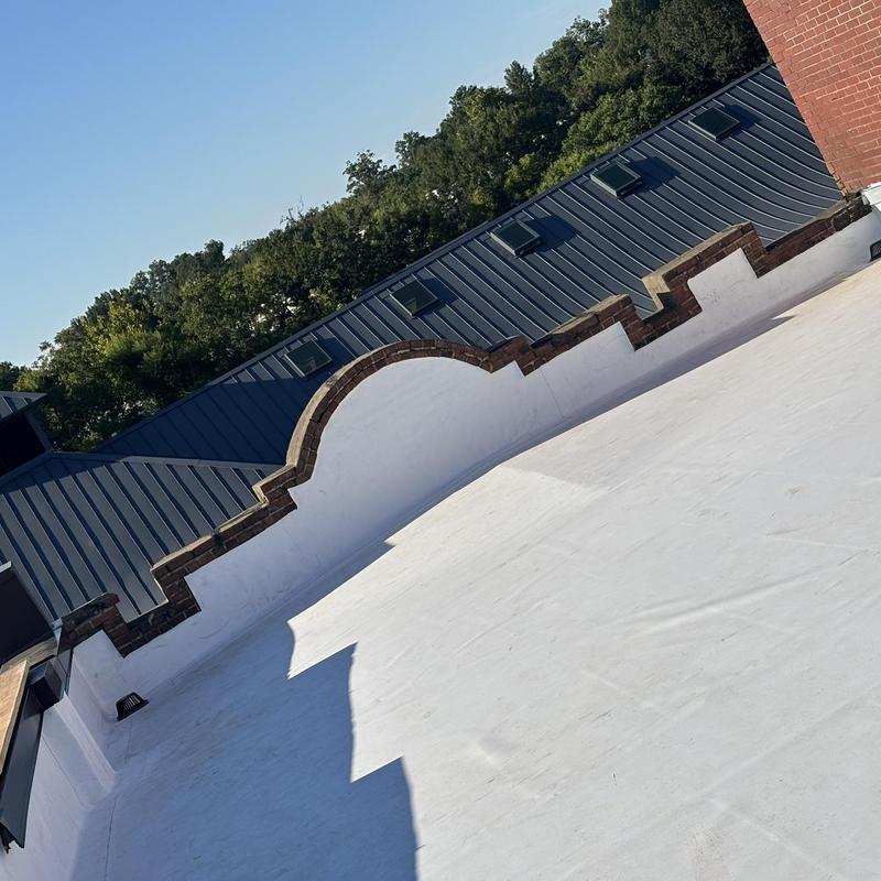 TPO roofing membrane with brick parapet wall restoration TPO roofing membrane with brick parapet wall restoration