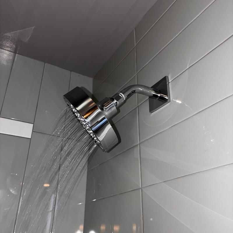 Shower head with improved water flow after debris cleaning