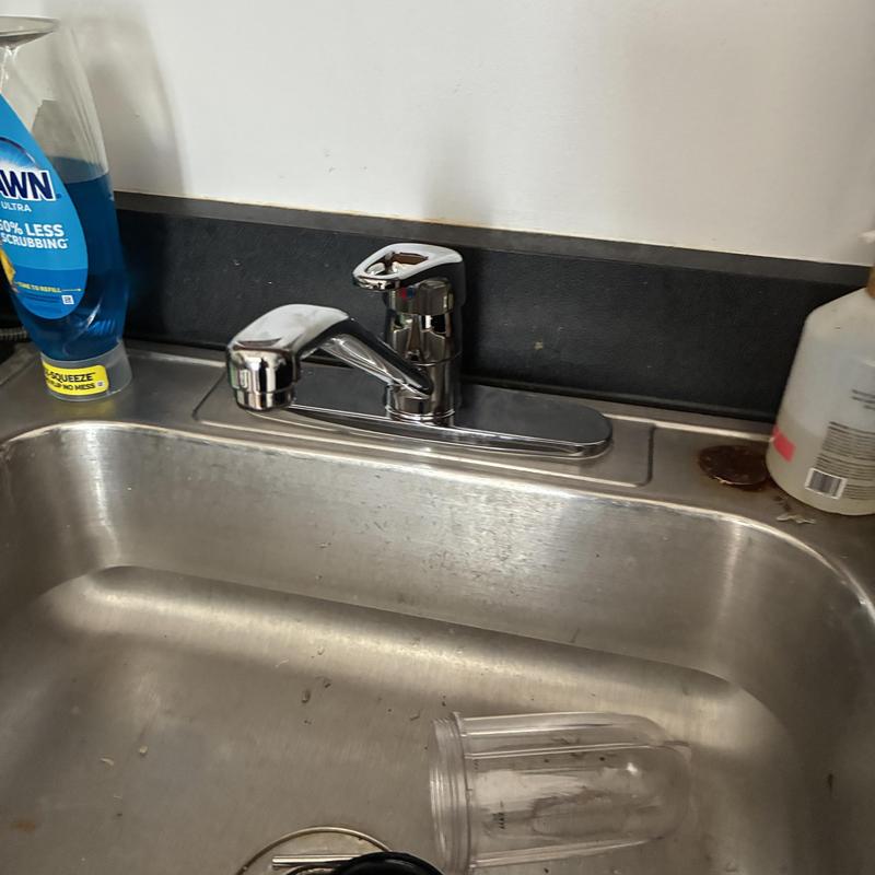 Kitchen sink faucet replacement and installation in stainless sink