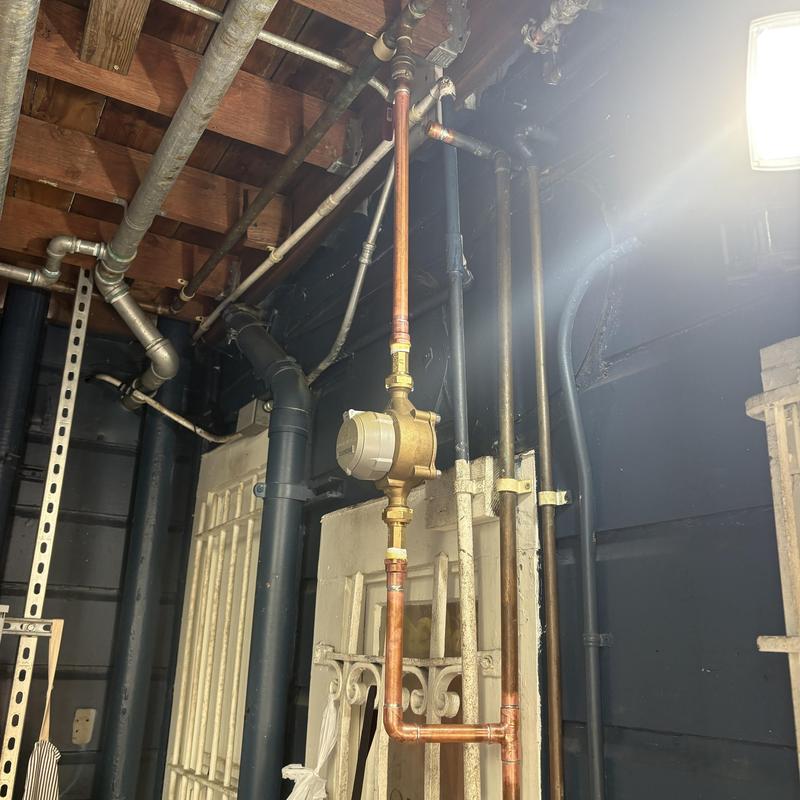 Sub meter assembly on copper water pipe installation