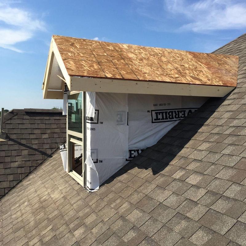 Dormer window framing and roof sheathing installation