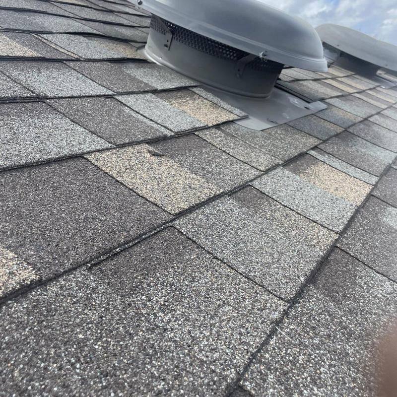 Asphalt shingle roof vent with new flashing installation