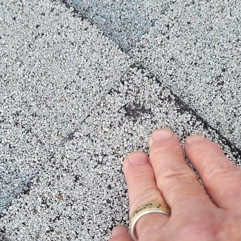 Roof shingles close-up showing hail impact damage