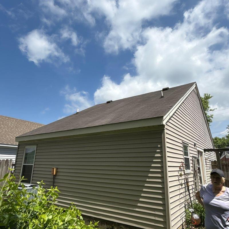 Asphalt shingle roof with hail damage inspection